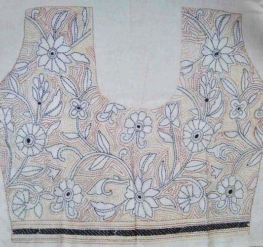 Close-up of floral Kantha hand embroidery on cotton blouse fabric