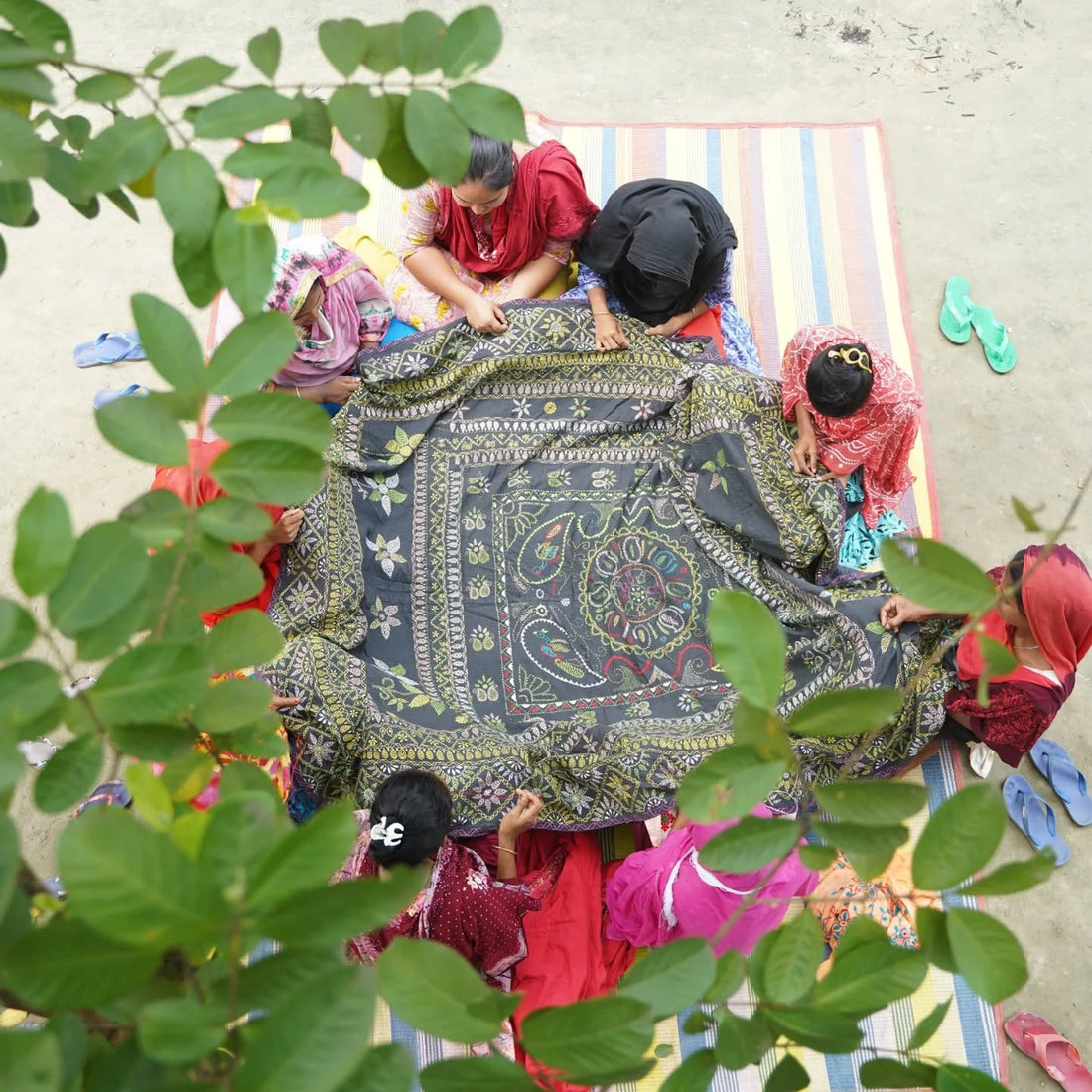 Women artisan from Nanur village working on traditional Bengal Kantha embroidery